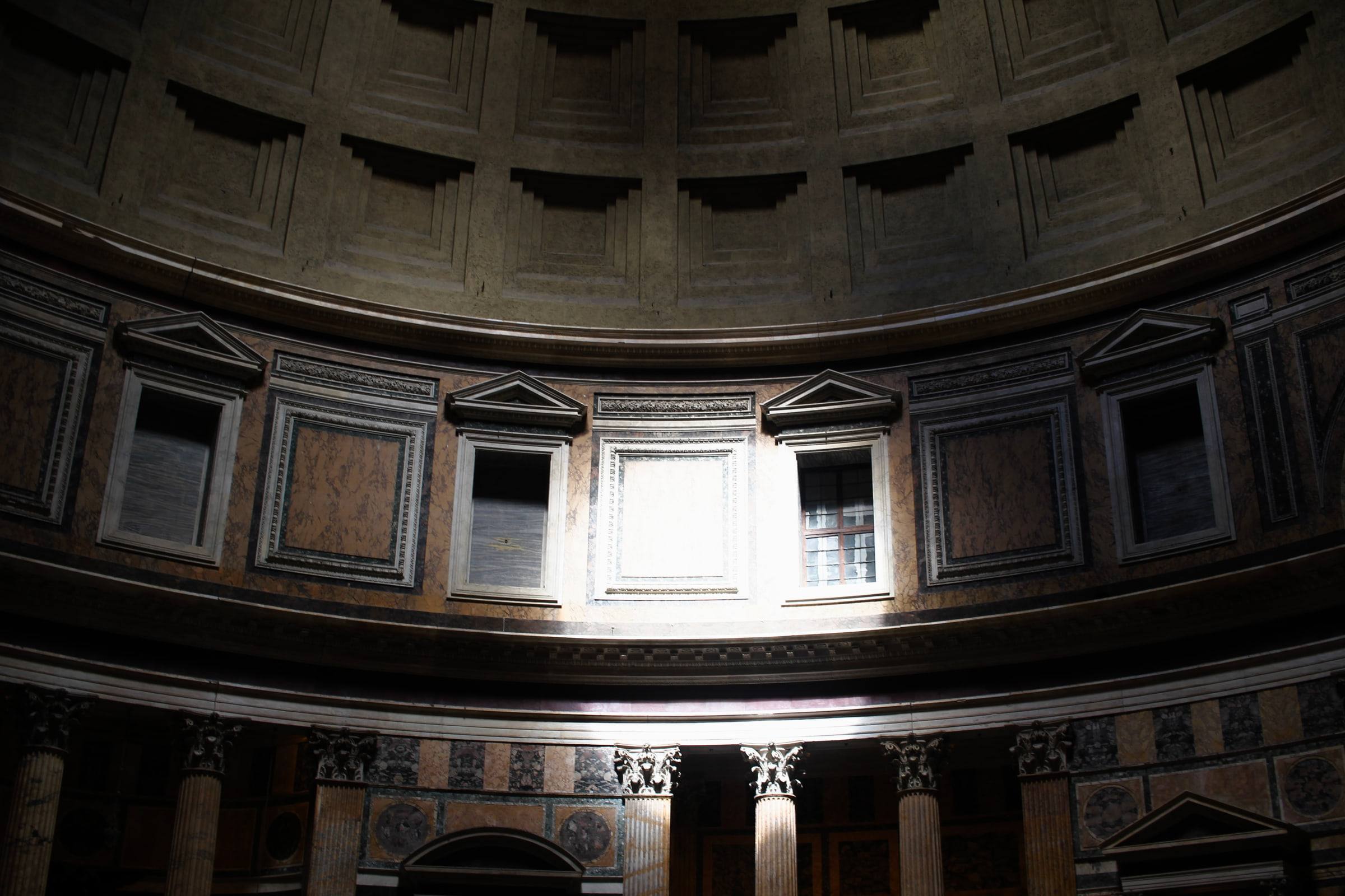 The upper drum of the Pantheon, windows and blind niches running round it.